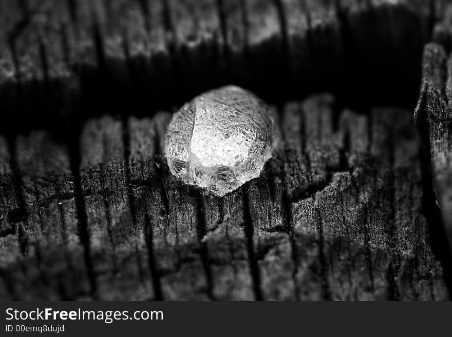 Extreme macro of a resin drop on a wood