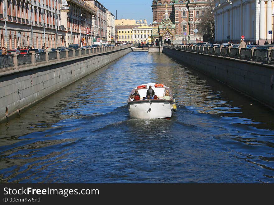 Tourictic boat on city channel. St.Petersburg, Russia. Tourictic boat on city channel. St.Petersburg, Russia