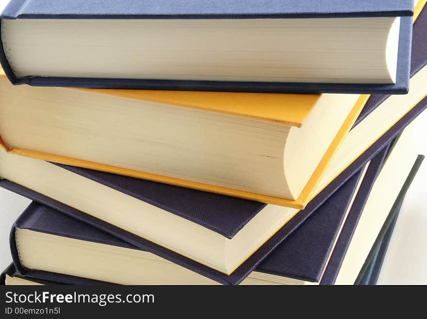 Stack of books against a white background