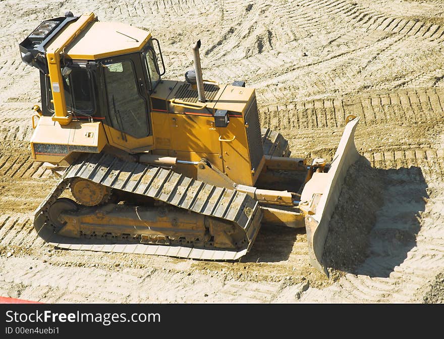 Bulldzer in action - road buulding ground scrapper. Bulldzer in action - road buulding ground scrapper