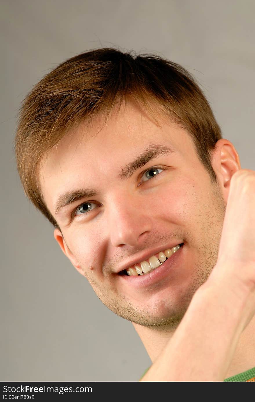 Portrait of young smiling guy emotionally gesticulating hands, close up, vertical. Portrait of young smiling guy emotionally gesticulating hands, close up, vertical