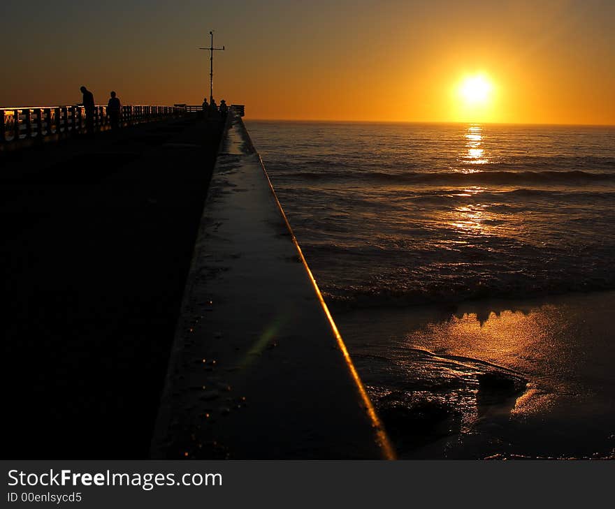 Down The Pier At Sunrise