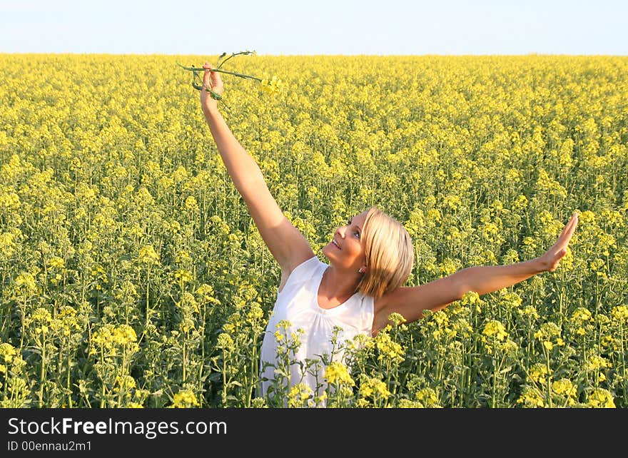 A beautiful young woman and yellow flowers. A beautiful young woman and yellow flowers