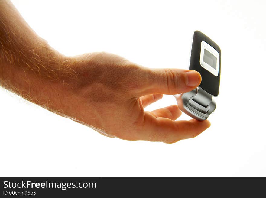 View of a man opening his mobile phone to make a call. View of a man opening his mobile phone to make a call