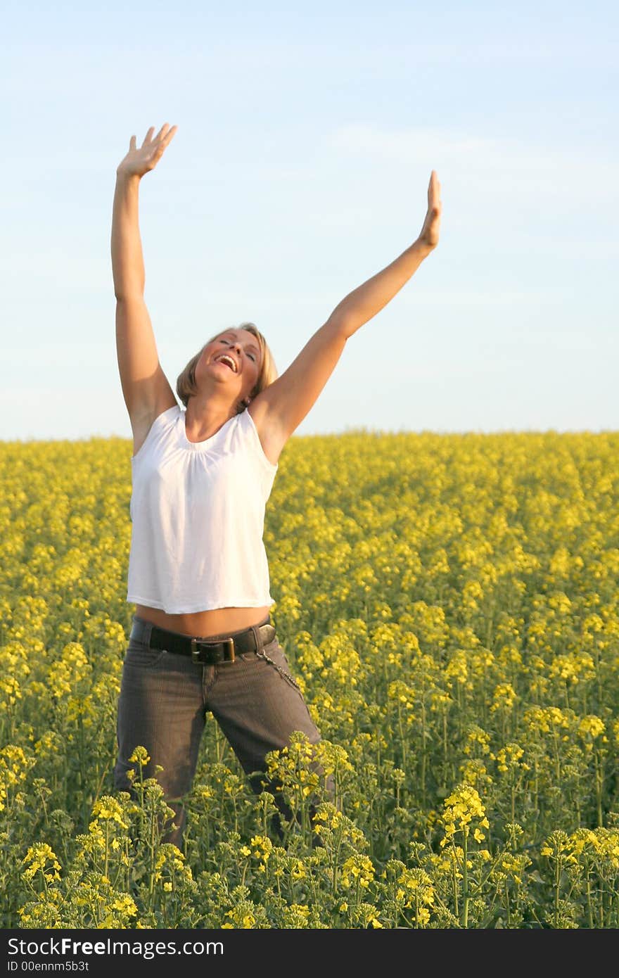 A beautiful young woman and yellow flowers. A beautiful young woman and yellow flowers