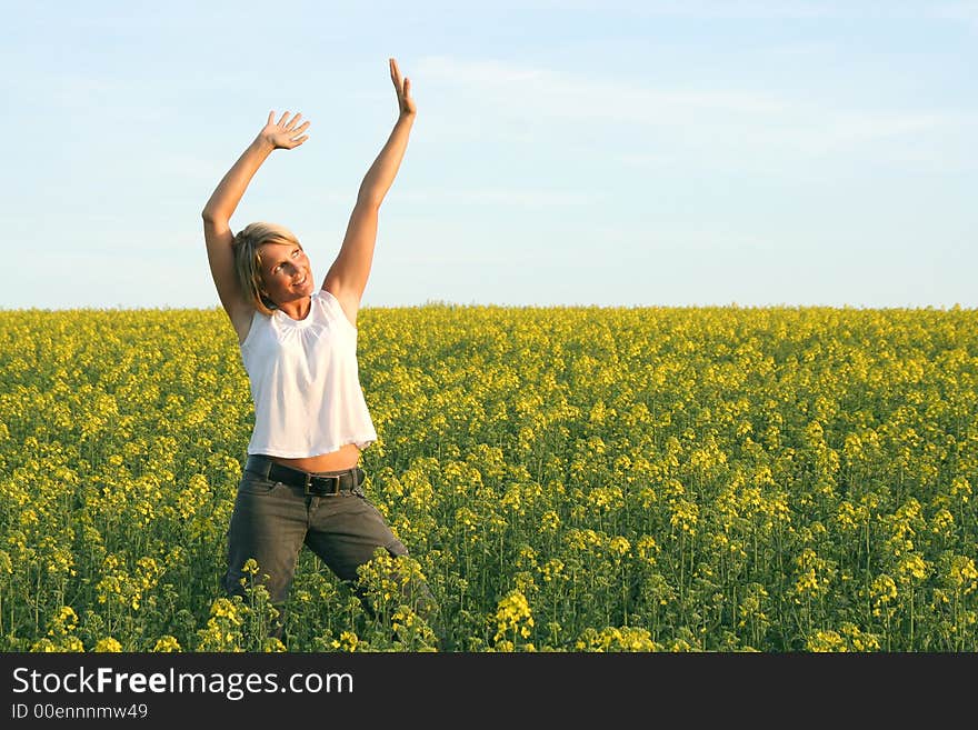 A beautiful young woman and yellow flowers. A beautiful young woman and yellow flowers