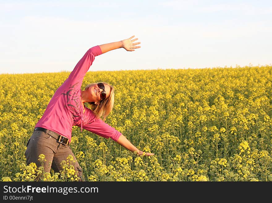 A beautiful young woman and yellow flowers. A beautiful young woman and yellow flowers