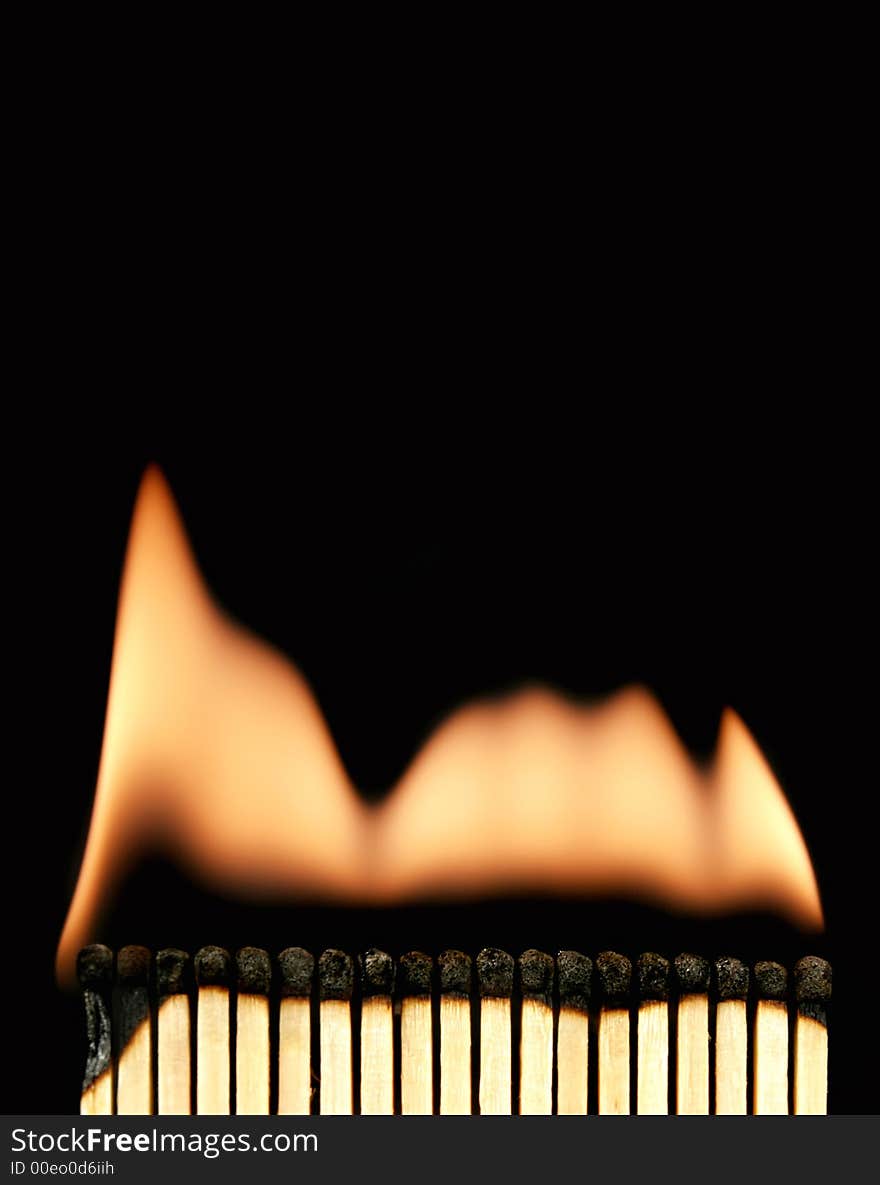 Photo of an burning matches on black. Photo of an burning matches on black