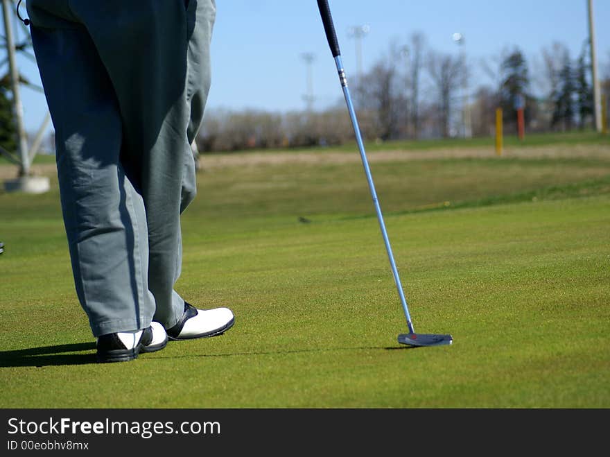 Photo of recreation park with people playing golf. Photo of recreation park with people playing golf