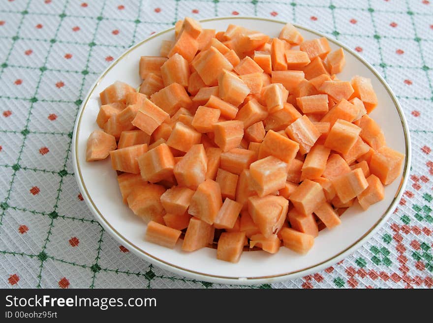 Slices of carrots on a white plate. Slices of carrots on a white plate