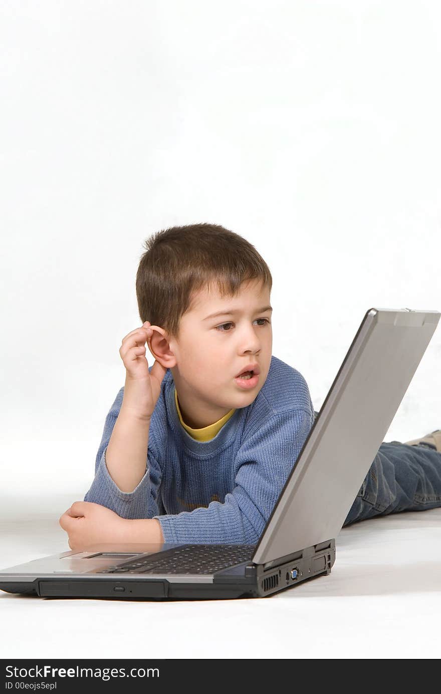 Small boy looking at the laptop display. Small boy looking at the laptop display