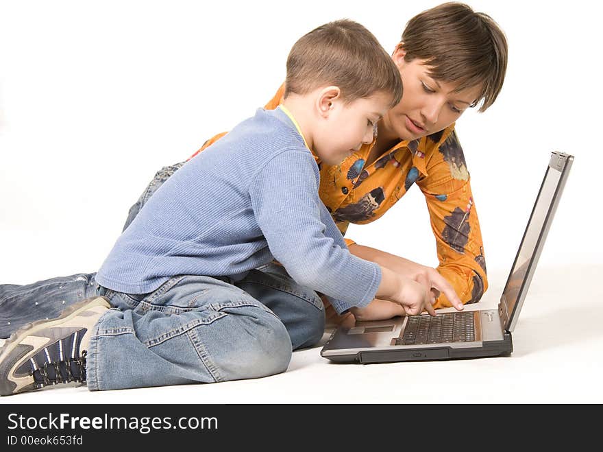 Mother and son looking at display over white. Mother and son looking at display over white