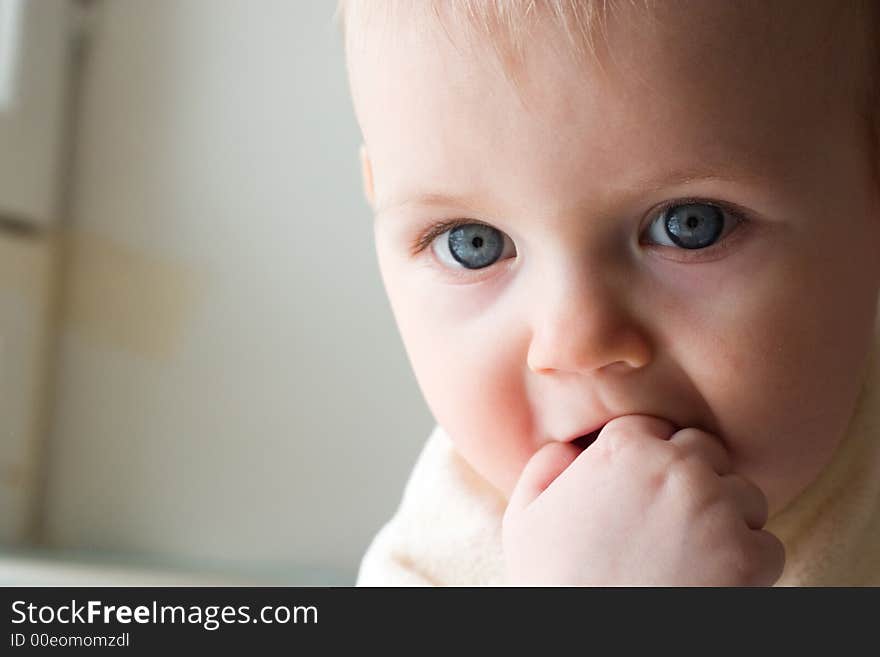 Cute little girl in the light of sun