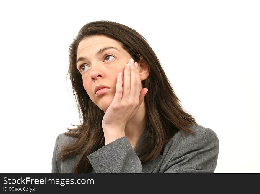 Thinking business woman in a suit isolated over white background