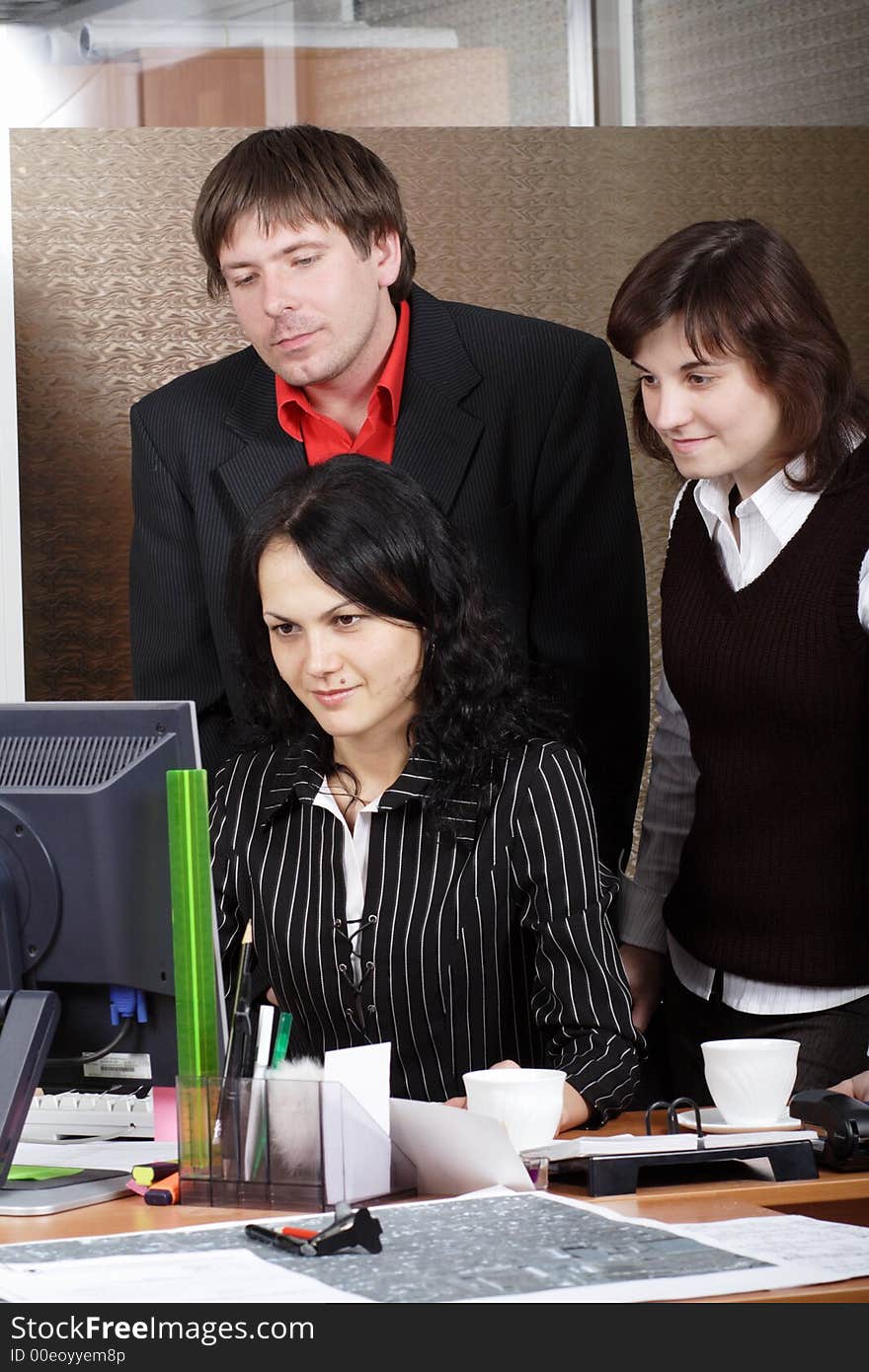 Group of 3 business people working together in the office. Group of 3 business people working together in the office.