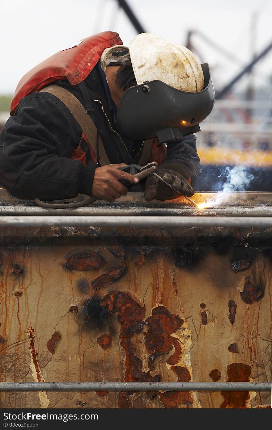 One welder working on steel project. One welder working on steel project