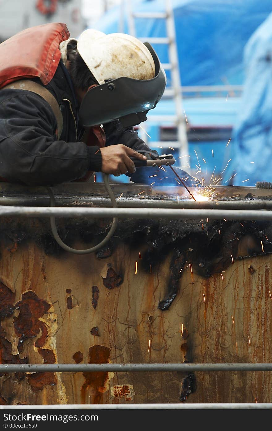 One welder working on steel project. One welder working on steel project