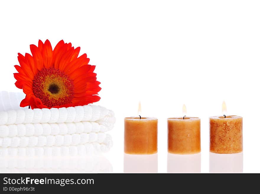 Candles, flower, and white towels. Candles, flower, and white towels