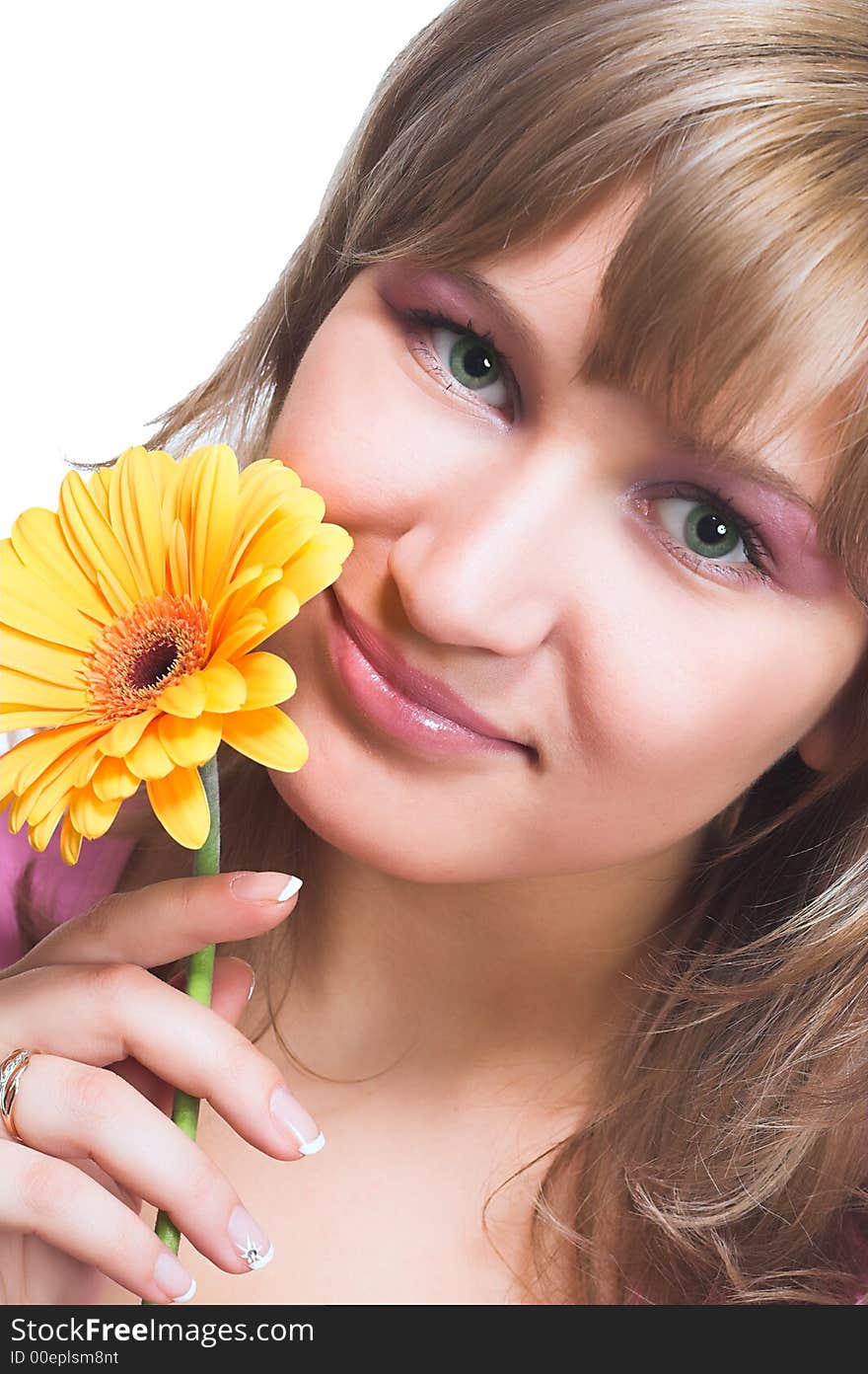 Young women holding a yellow flower and wearing a pink top. Young women holding a yellow flower and wearing a pink top