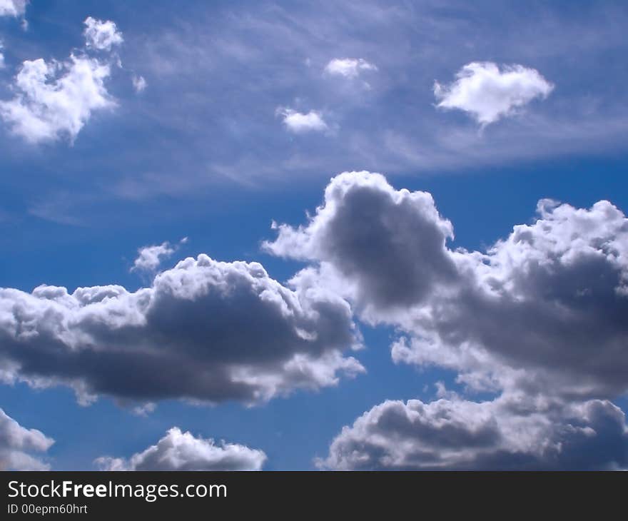 White clouds in blue sky on sunny day