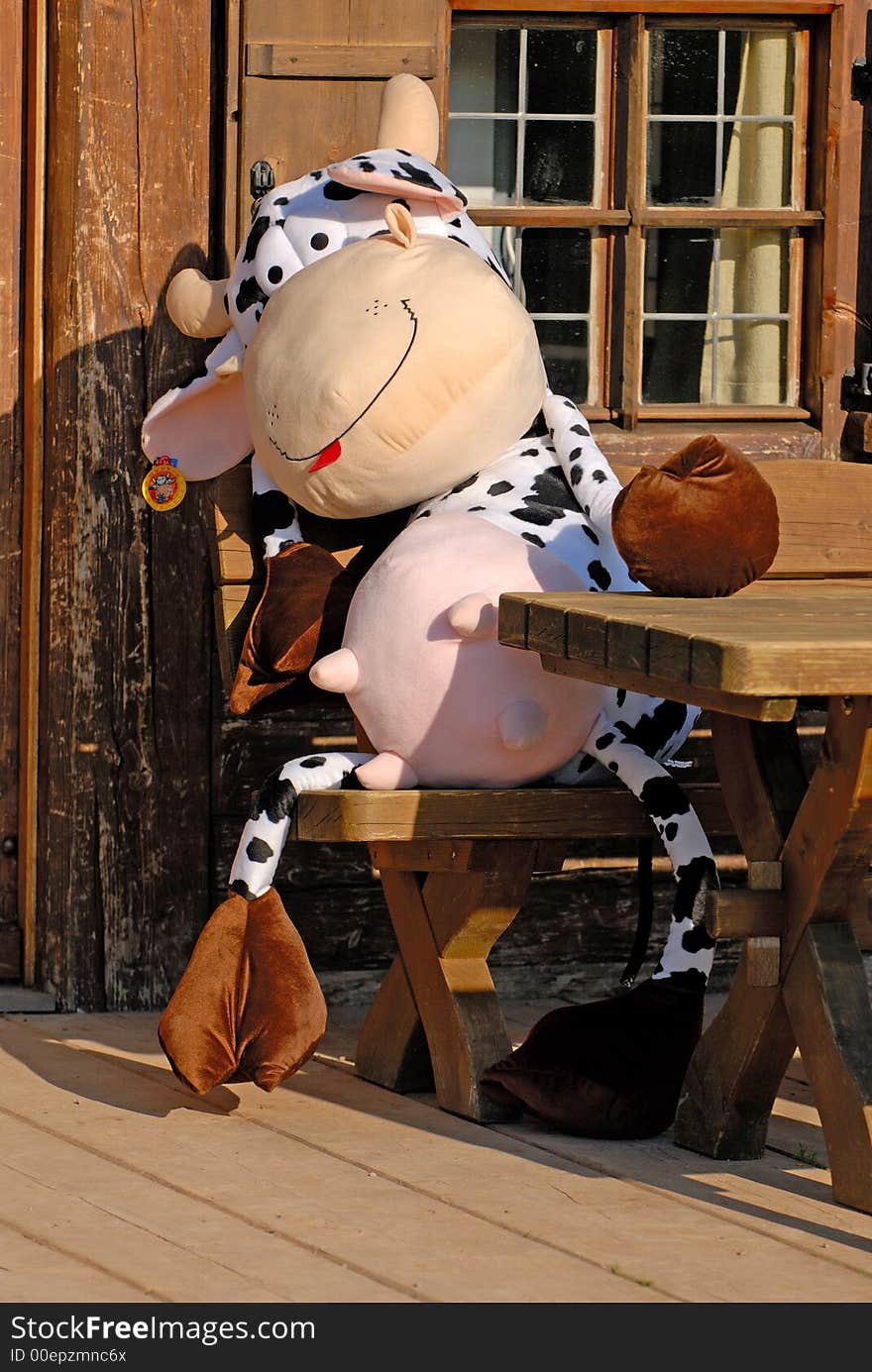 Bavarian cow at the table in restaurant