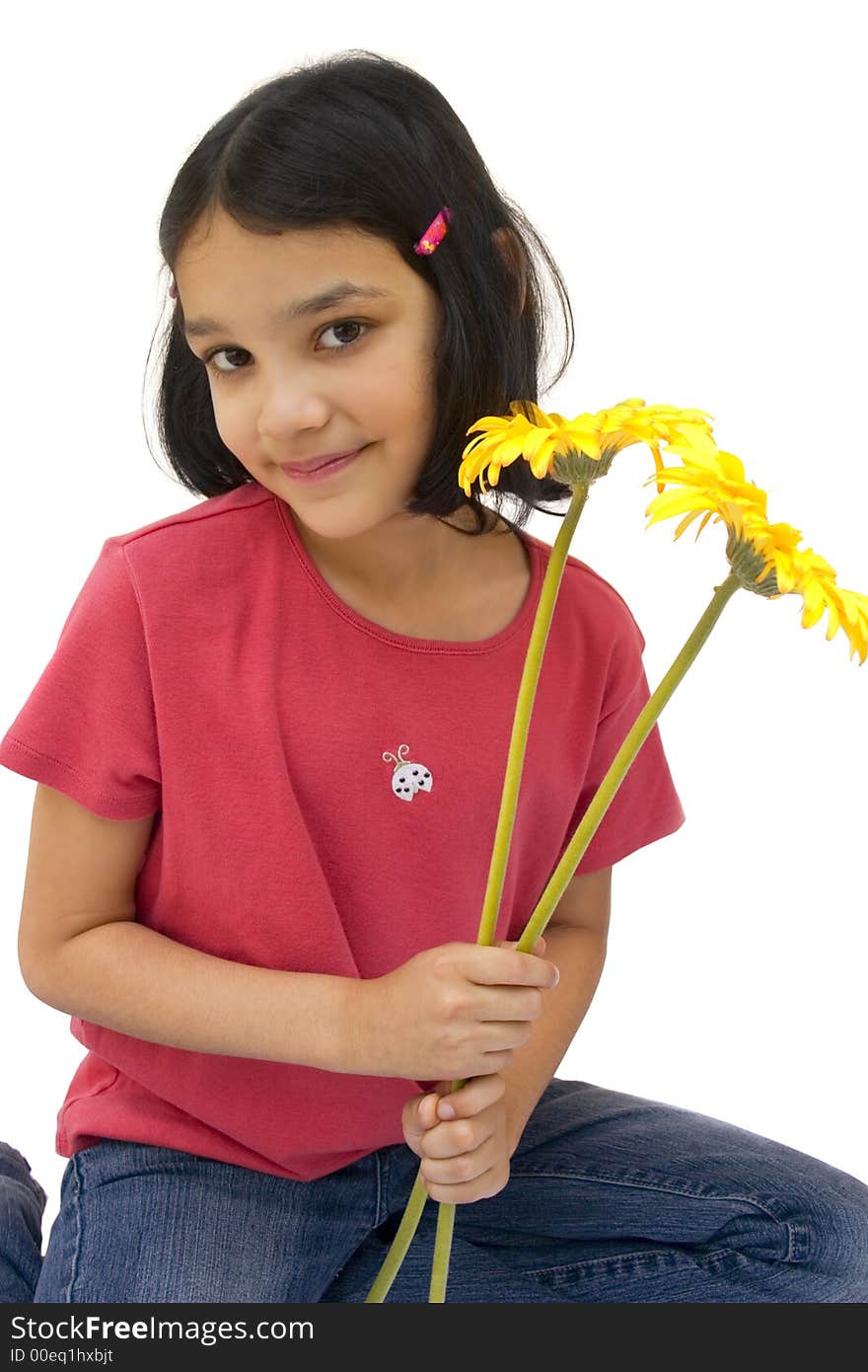 Studio shot of girl holding yellow flowers. Studio shot of girl holding yellow flowers.