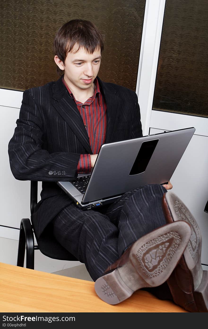 Portrait of a businessman in a working process. Portrait of a businessman in a working process