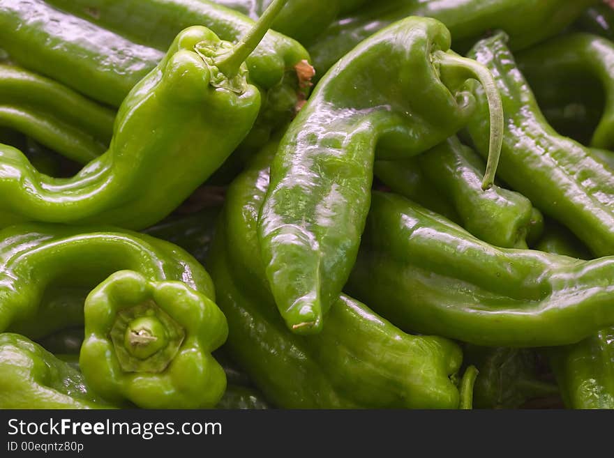 A box of fresh green pepper in a fruit shop. A box of fresh green pepper in a fruit shop