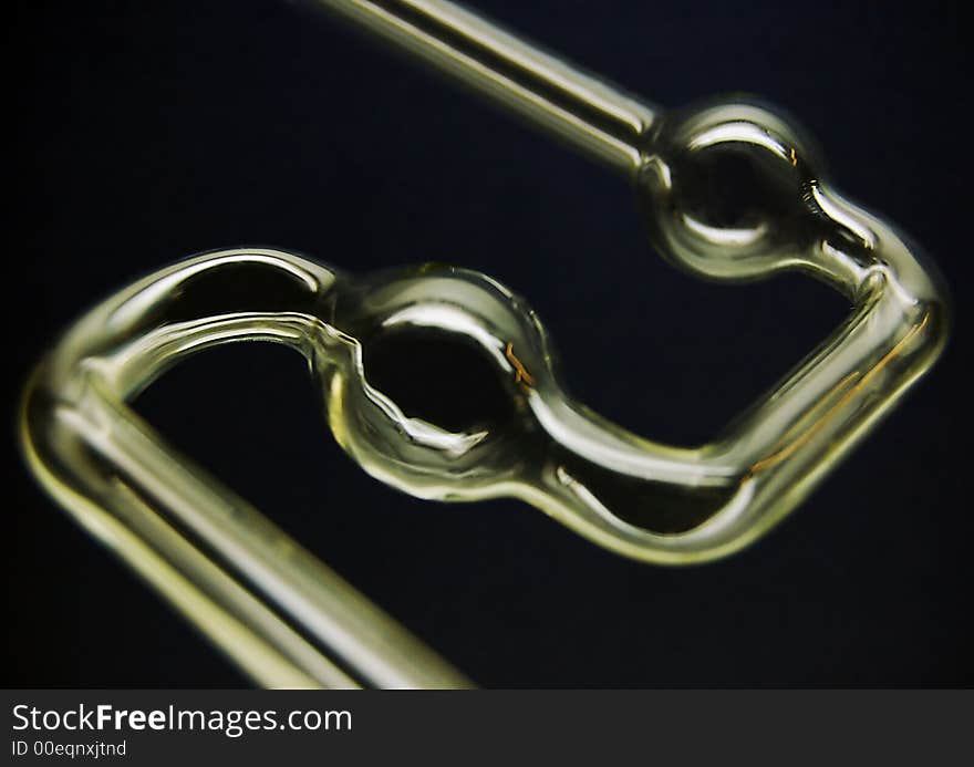 Chemical glass tube in the dark background. Chemical glass tube in the dark background