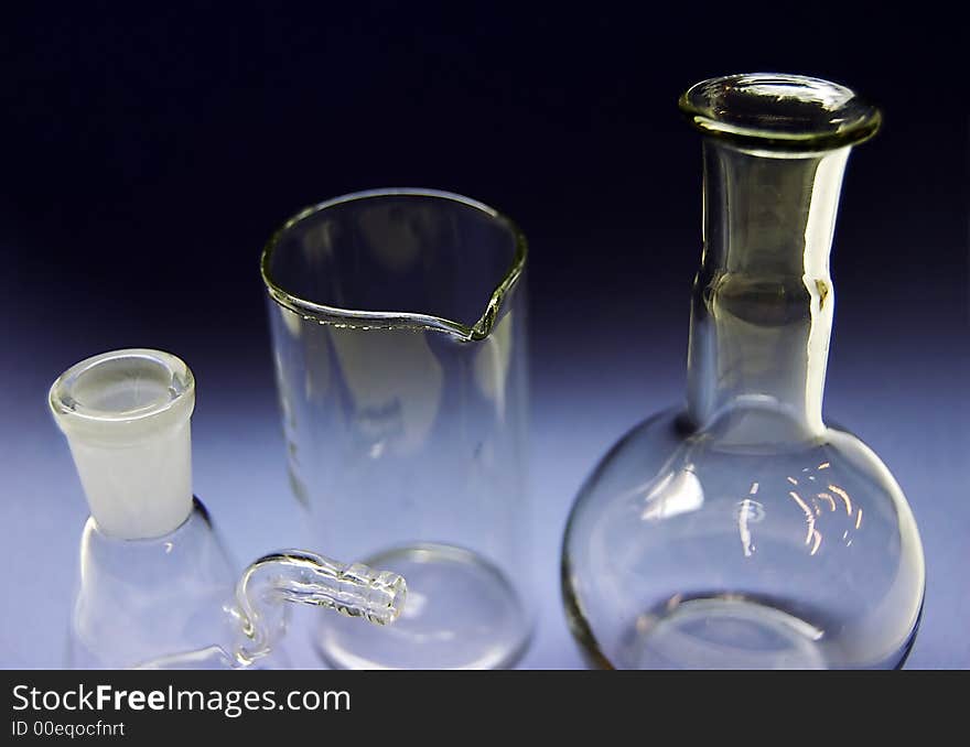 Chemical flasks in a dark background. close-up. Chemical flasks in a dark background. close-up