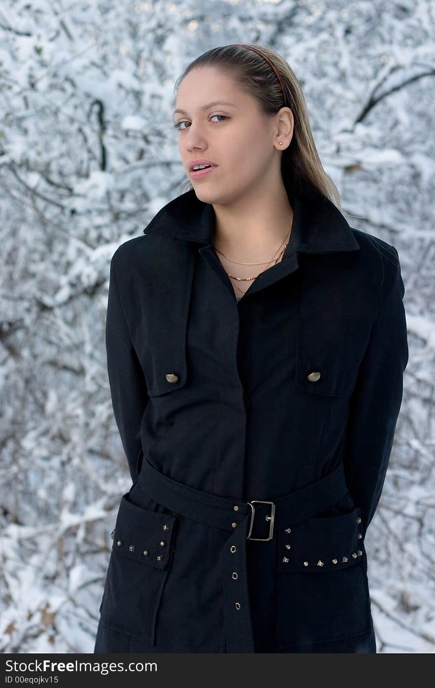 Young girl in black on light background. Young girl in black on light background