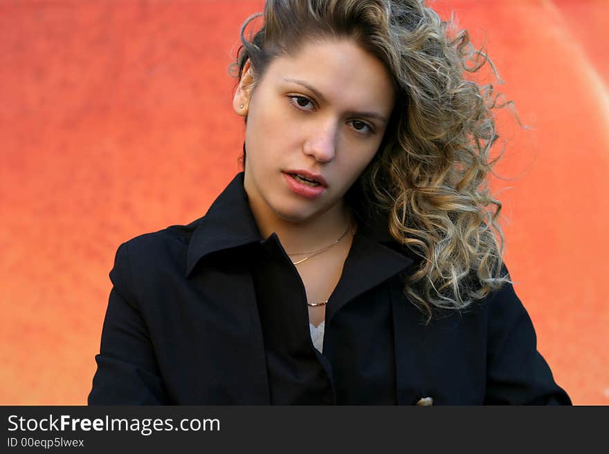 Girl in black with direct sight on orange