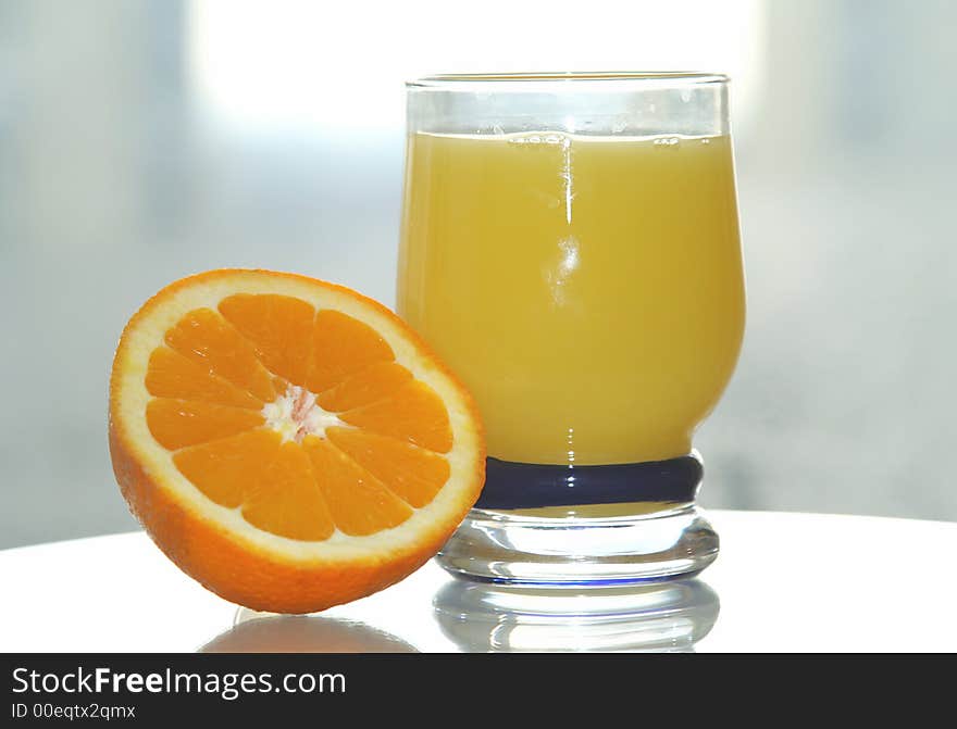 Background of juicy fresh sliced orange with orange juice. Background of juicy fresh sliced orange with orange juice