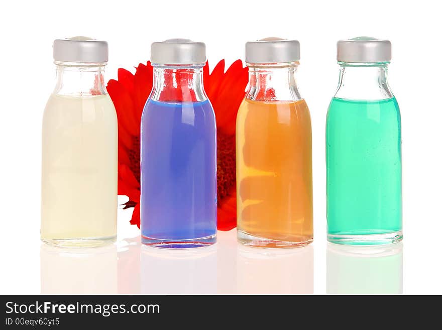 Spa bottles with flower in the back. Spa bottles with flower in the back