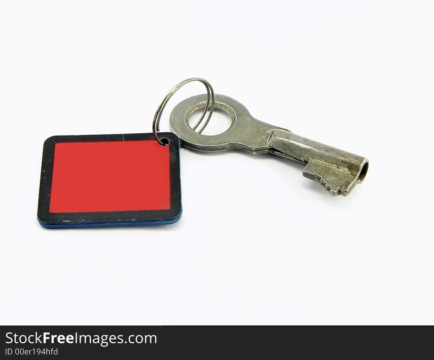 Key on the ring with the red tally, against the white background. Key on the ring with the red tally, against the white background.