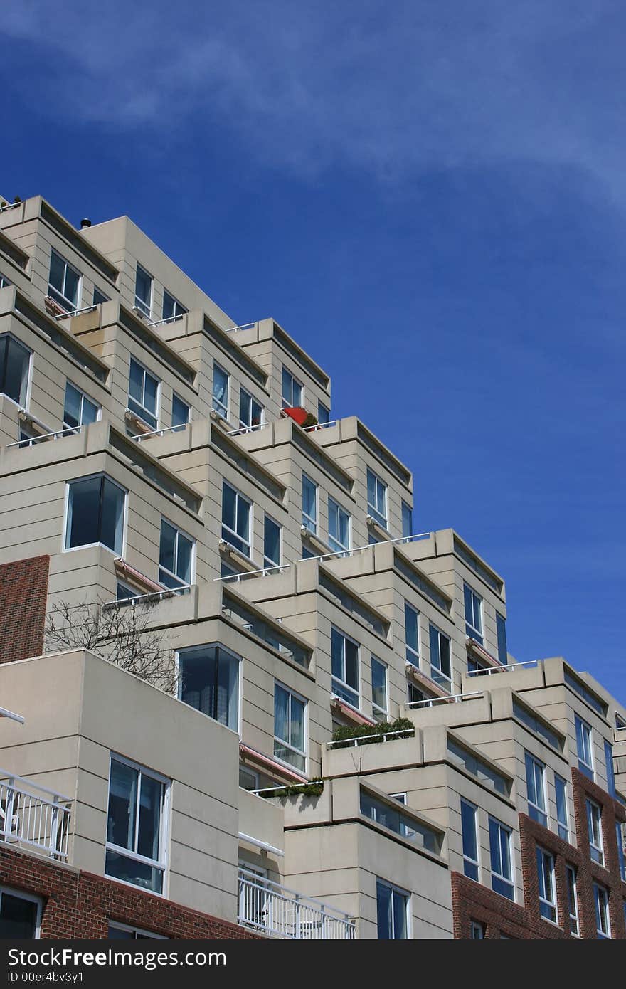 Windows and balconies on a generic, urban building. Windows and balconies on a generic, urban building.