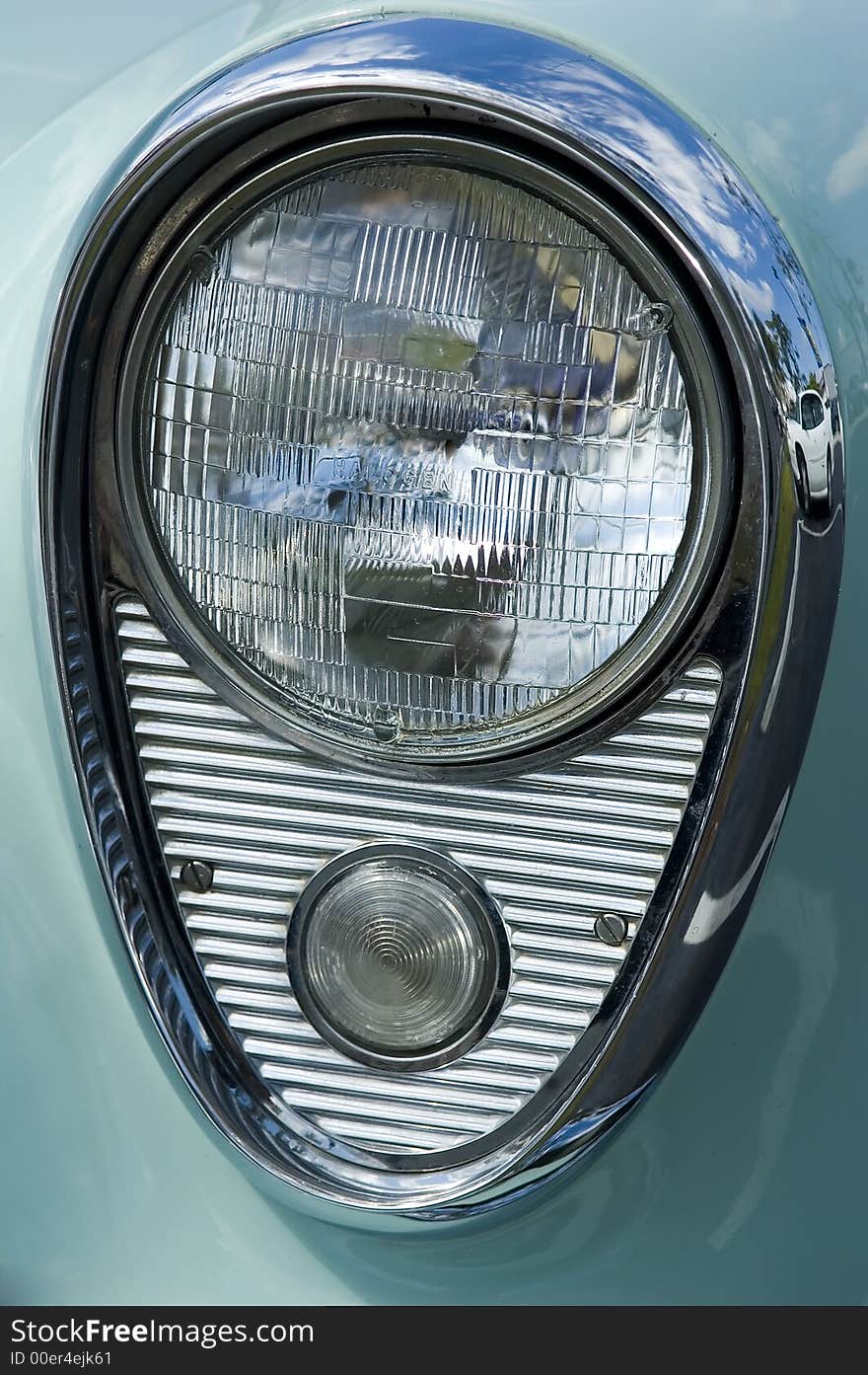 Closeup of classic vintage headlight on a 1950's US auto. Closeup of classic vintage headlight on a 1950's US auto