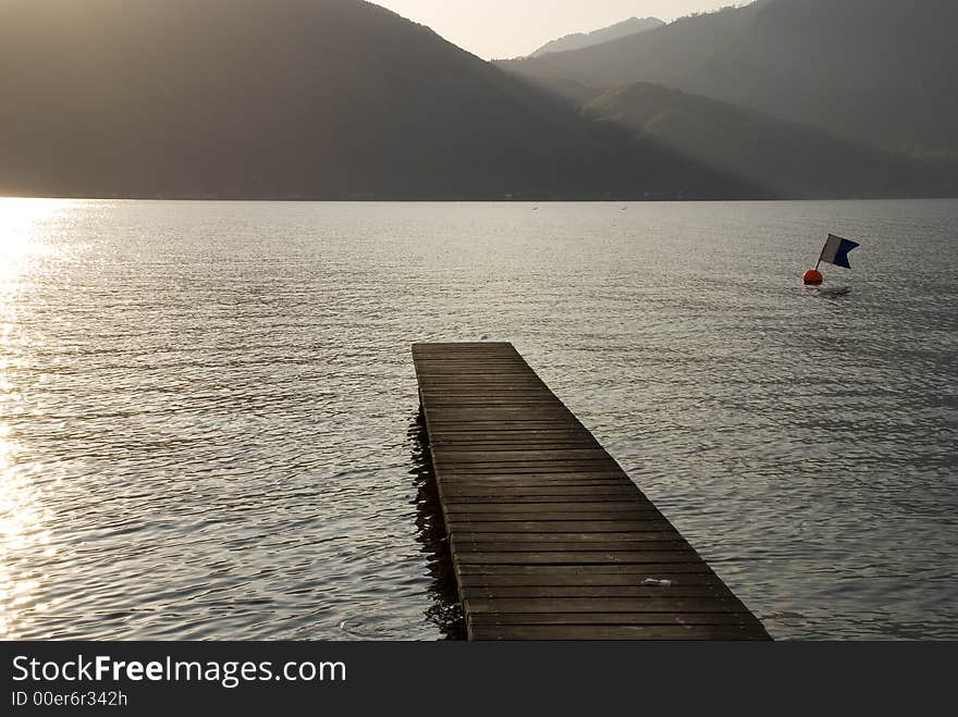 Footbridge leading into lake Traunsee in Austria.