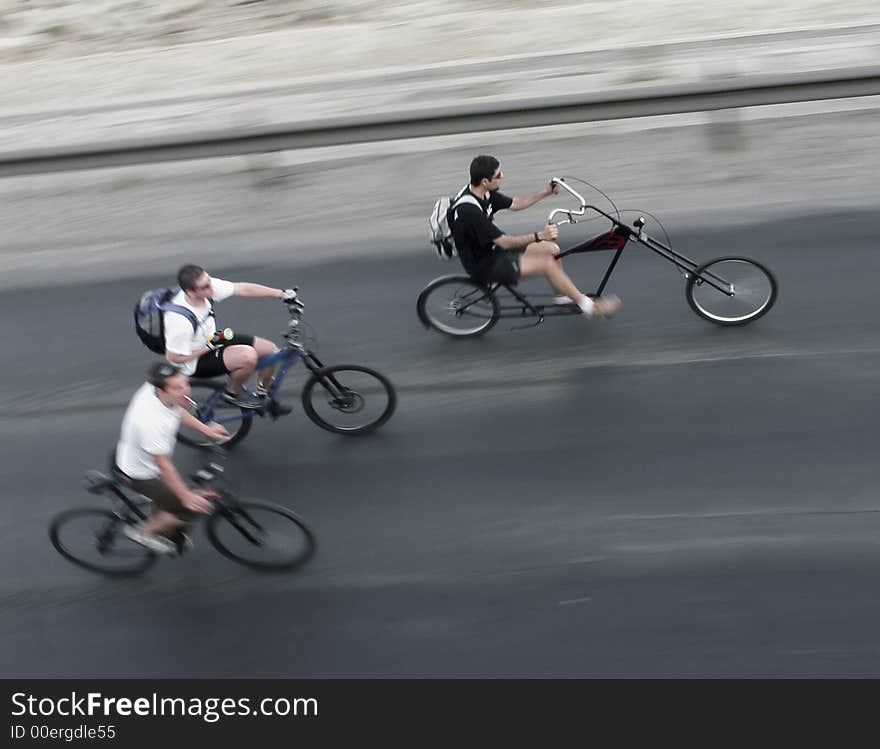 Three young cyclists in motion. Three young cyclists in motion