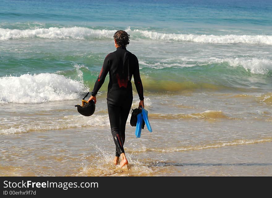 Surfer Looking Out At The Surf