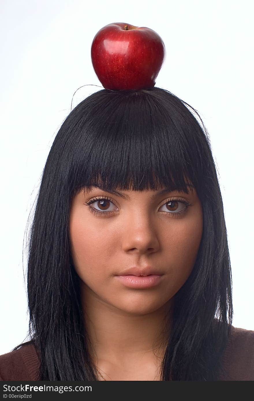 The girl with an apple on a white background