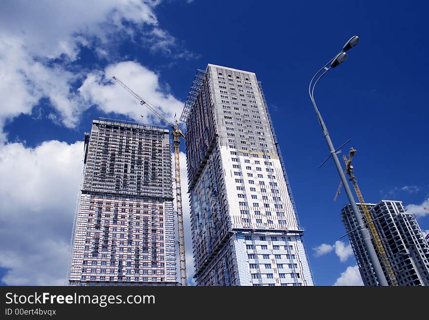 Modern building on the blue sky. Modern building on the blue sky