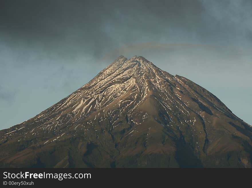 Mount Egmont with cloud gathering around it. Mount Egmont with cloud gathering around it