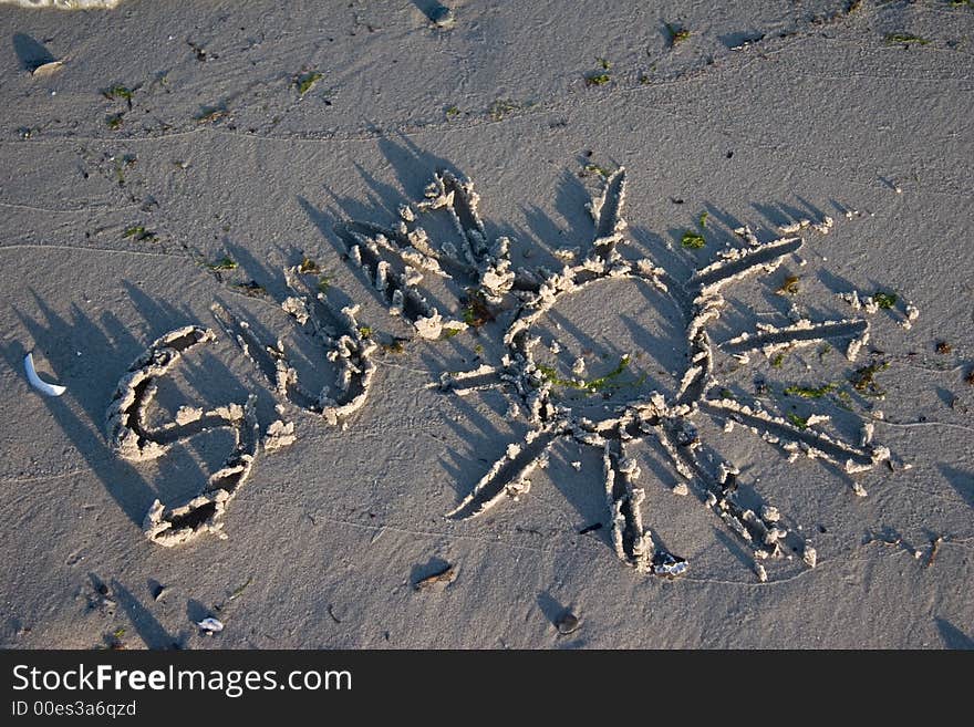 SUN painted on the beach