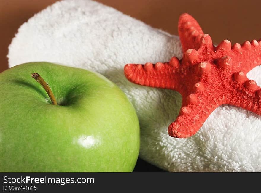 Big green apple and white towel