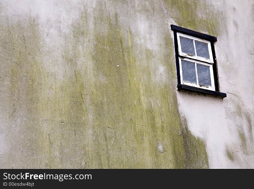 Solitary window with weathered wall