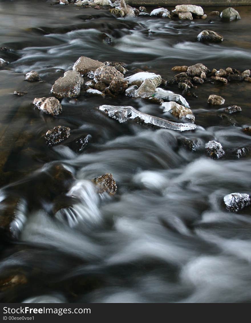 Icy river taken in slow shutter speed speed. Icy river taken in slow shutter speed speed