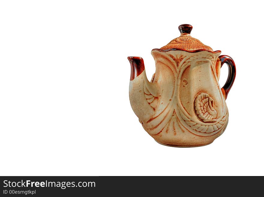 Clay teapot of manual job. Executed under olden time. Craft of masters of the Western Ukraine (no shadow - full isolated). Clay teapot of manual job. Executed under olden time. Craft of masters of the Western Ukraine (no shadow - full isolated)