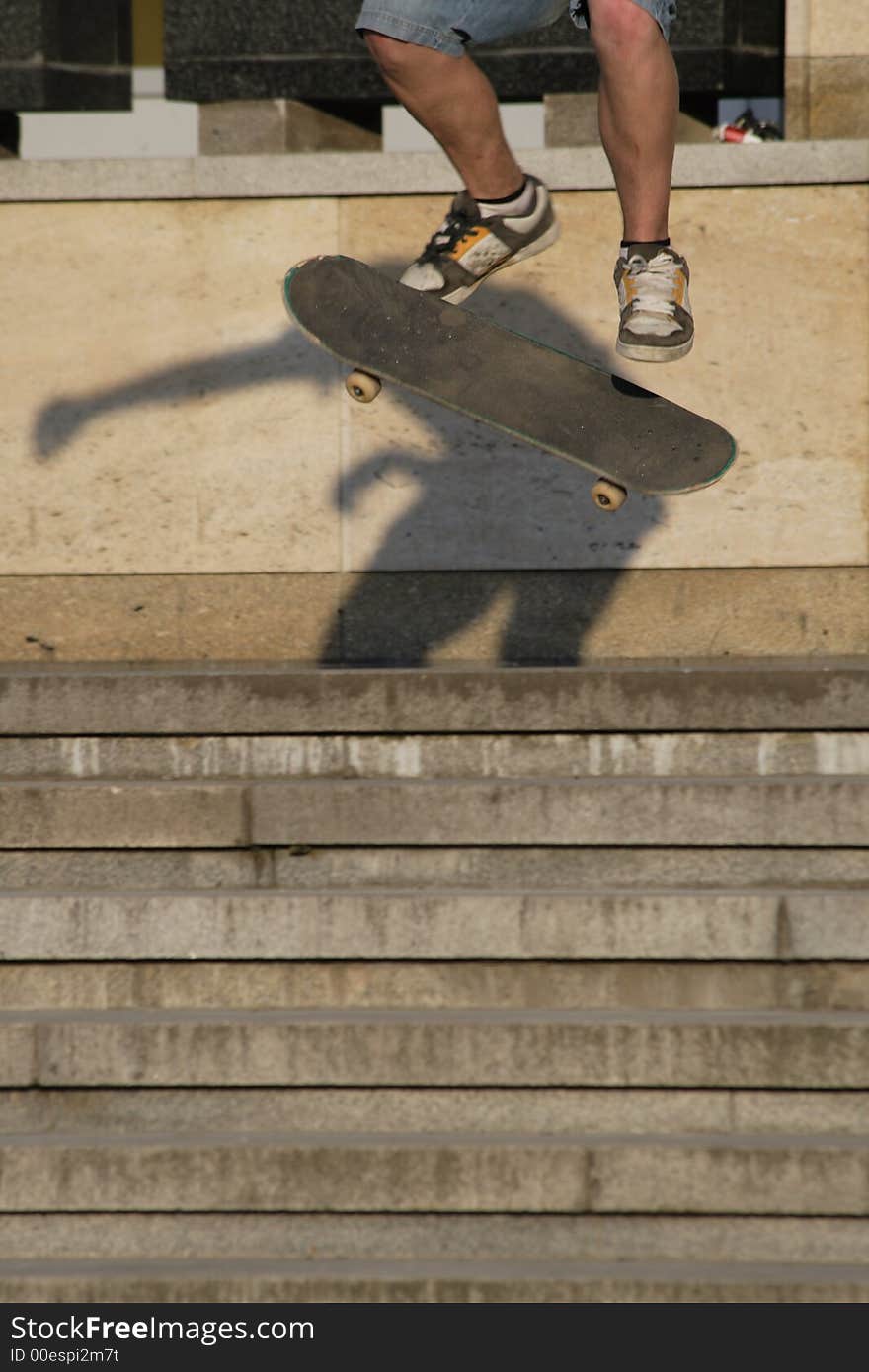 A young man goes on skateboard on stairs. A young man goes on skateboard on stairs