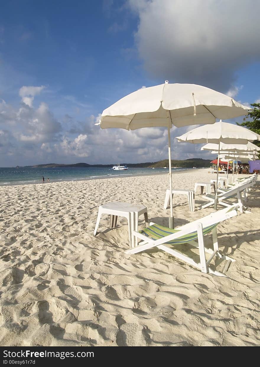 Chairs and parasols on the bea